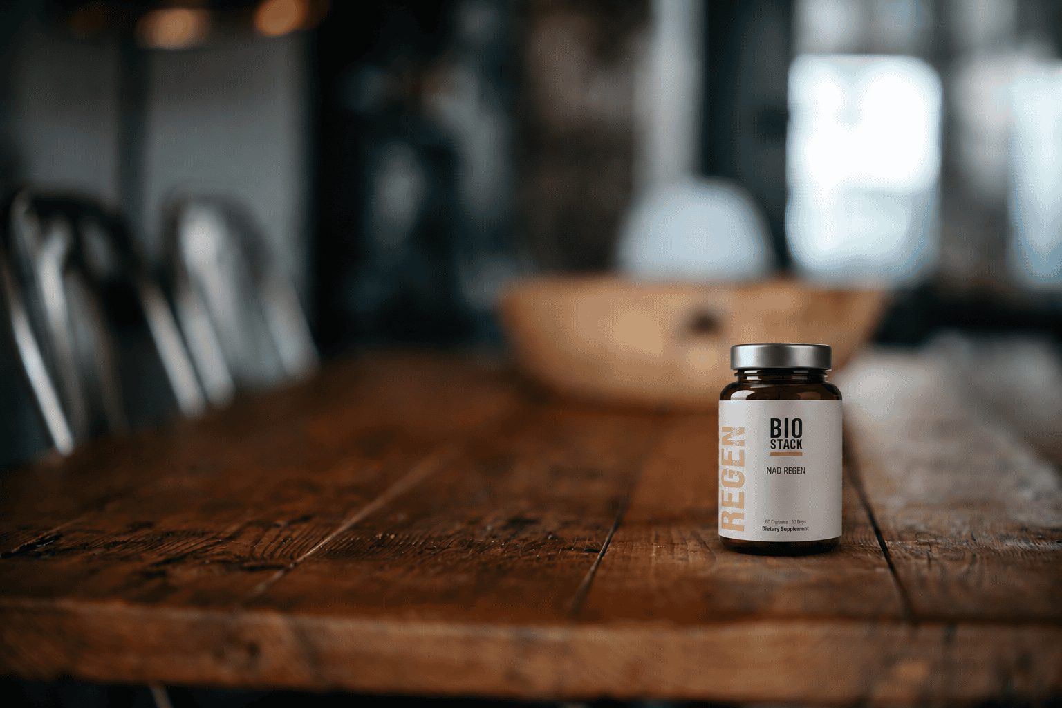 NAD Regen bottle resting on a rustic wooden table
